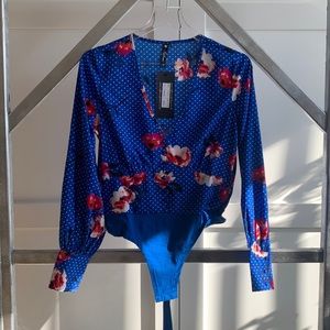 Blue polka-dot bodysuit with floral print